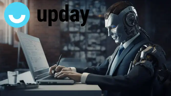 robot che usa computer e logo di upday